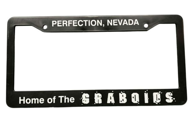 Lot 599 - Tremors 2: Aftershocks (1996) - Prop License Plate Cover