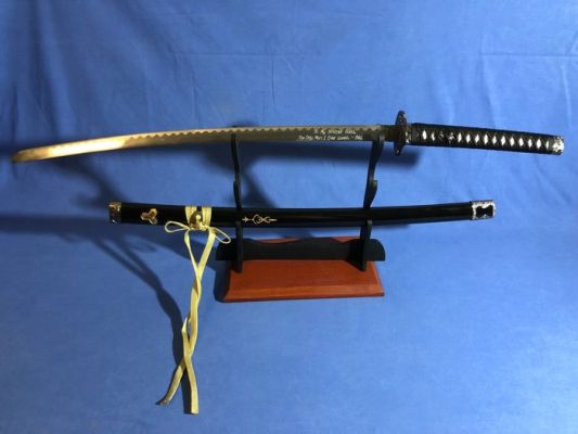 Kill Bill, Rare 1 DELUXE Version Production Katana of the movie "KILL BILL" of the character "BUDD" - With Dedication Engraved on the Blade. Michael Madsen (Budd). - Blade is made of Stainless Steel (TOSHIN), Scabbard (SAYA) is in Magnolia Wood. NEW | Catawiki