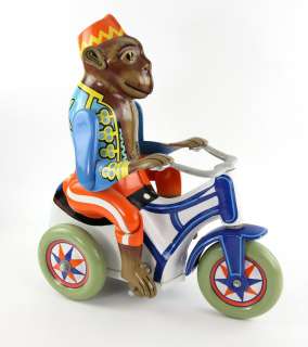 Toys (1992) An oversized vintage Monkey riding a tricycle clockwork tinplate toy used in the Zevo To | Ewbank’s