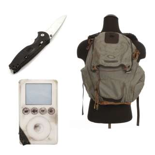 THE BOOK OF ELI - Eli (Denzel Washington) backpack, iPod, and switchblade