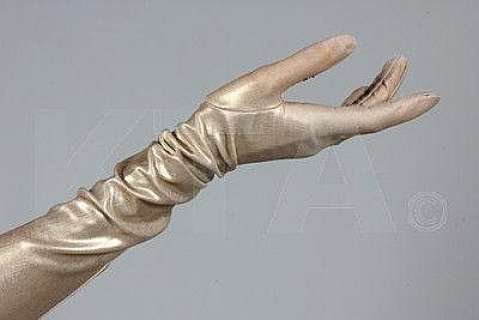 A pair of gold stretch nylon evening gloves worn | Kerry Taylor Auctions