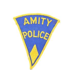 Jaws (1975) - â€˜Amity Policeâ€™ Uniform Patch.Triangular cotton costume patch, bearing â€˜Amity Pol | Ewbank’s