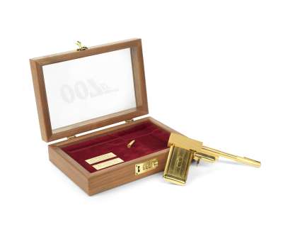 Lot 823 - A replica of the Golden Gun presented to Sir Christopher Lee for his role as "Scaramanga" in The Man with the Golden Gun
