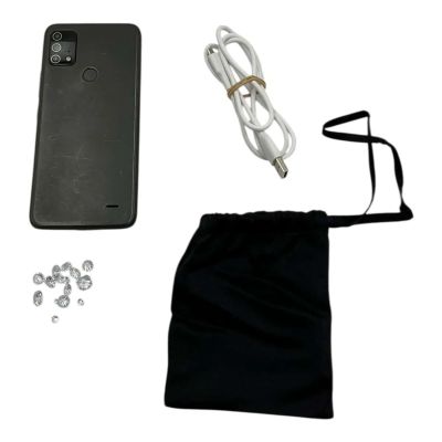 Play Dirty Parker Screen Used Phone W/Charge Cord & Pouches W/Fake Diamonds | VIP Fan Auctions