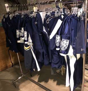 Rack of Football Costumes Tops and Bottoms Approx. 25 Pieces | Direct Liquidation