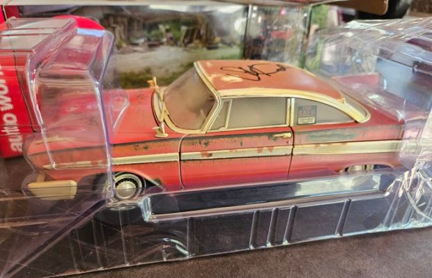 Christine - John Carpenter signed the car with Celebrity Authentics !