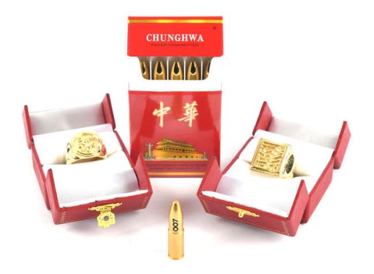 Lot 2184 - James Bond 007 - The Man With The Golden Gun (1974), five Golden Gun bullets concealed in a Chinese… | Ewbank’s