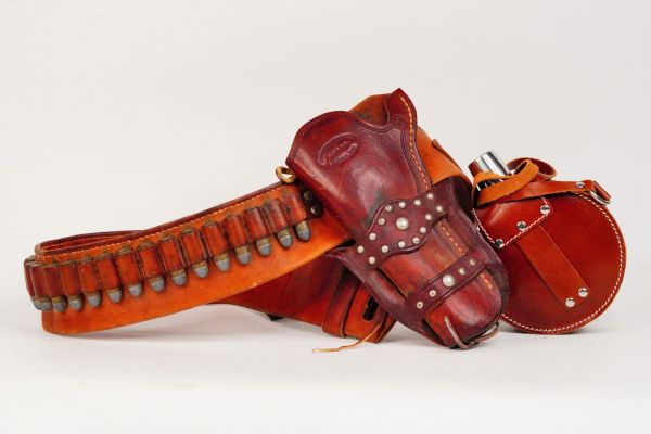 Lot 145 - Richard Roundtree "Outlaws" (1986) Leather Belt, Holster, and Flask | GWS Auctions