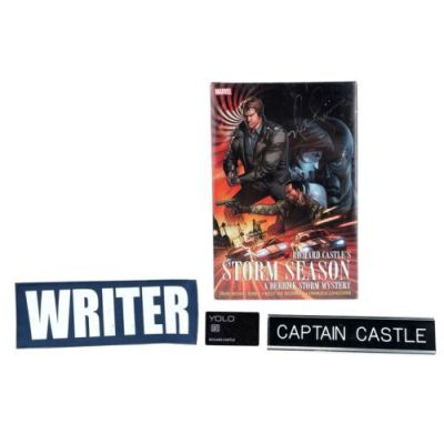 CASTLE (T.V. SERIES, 2009-2016) - Lot #573 : Richard Castle‘s (Nathan Fillion) "Writer" Patch, "Captain Castle" Nameplate, and "YOLO" Credit Card with Fillion-Autographed Richard Castle‘s Storm Season Graphic Novel