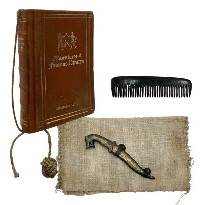 Lot 123: The Bluff Issac Screen Used Book, Rubber Dagger W/Case, Dagger Wrap & Comb | VIP Fan Auctions