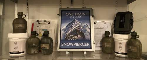 "Snowpiercer" - Group of set dec collectibles includes Wilford Industries water bottles/empty food t | Direct Liquidation