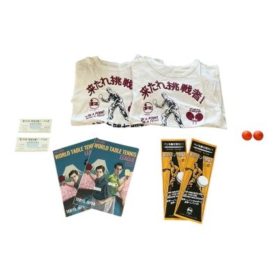 Lot 74: Marty Supreme Production Used (2) Event T-Shirt Set, (2) World Table Tennis Pamphlet Set, (2) Event Brochure Set, (2) Event Ticket Set & (2) Marty Supreme Ping Pong Ball Set | VIP Fan Auctions