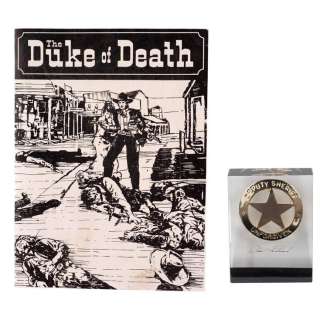 UNFORGIVEN (1992) - Lot #407 : W.W. Beauchamp‘s (Saul Rubinek) "The Duke of Death" Novel Cover with Lucite-Encased Deputy Sheriff Badge Crew Gift