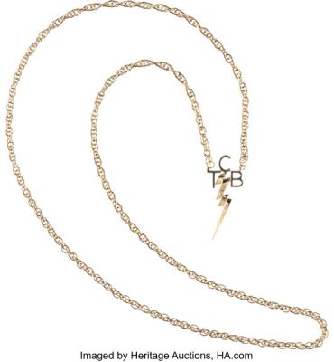 Elvis Presley 14K Gold "TCB" Prototype Necklace with Paperwork & Display Box (Schwarz & Ableser, 1970). | Heritage