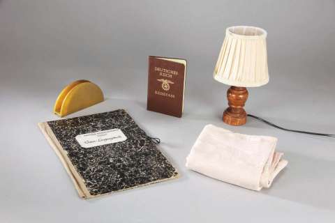 Lot 771 - Liam Neeson passport, Ben Kingsley notebook, table setting props from Schindler’s List