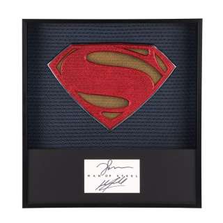 Man Of Steel (2013) - Lot 232 - Framed Promotional Superman Suit Emblem with Henry Cavill and Zack Snyder Autographs
