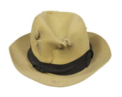 Lot 267 - DICK TRACY – Dick Tracy (Warren Beatty) signature hat with bullet holes.