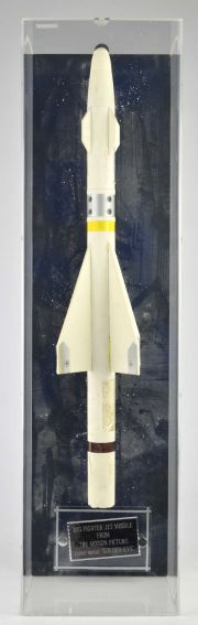 James Bond - (Golden Eye 1995), film props comprising a scale model Mig Rocket mounted in a Perspex… | Ewbank’s