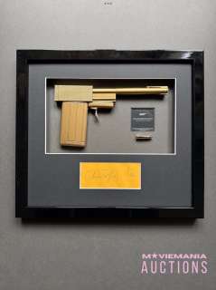 Lot 61 - James Bond: The Man With The Golden Gun (1974) - A Signed Duel Replica Prop Display