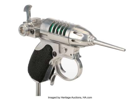 Barry Sonnenfeld’s Men in Black "Noisy Cricket" gun display.... | Profiles in History