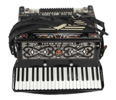 Lot 1214 - "FERRIS BUELLER‘S DAY OFF" PRODUCTION-USED ACCORDION AND ORIGINAL PHOTOS (WITH DVD)