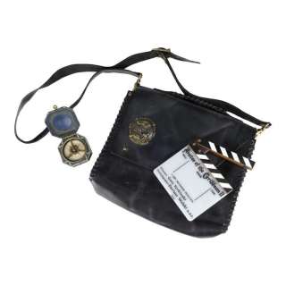 Pirates of the Caribbean: Dead Man’s Chest (2006)/Pirates of the Caribbean: At World’s End (2007) | Johnny Depp-Autographed Replica Compass, Crew Gift Messenger Bag, and Clapperboard | Propstore