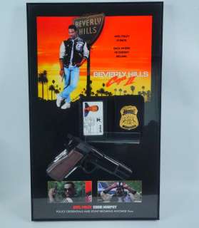 Beverly Hills Cop Axel Foley’s Prop Rubber 9mm and Badge | GWS Auctions