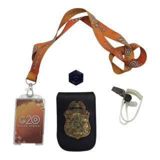 G20 Agent Darden (John Hoogenakker) Screen Used Secret Service Badge, G20 Lanyard, Secret Service Earpiece & Secret Service Pin | VIP Fan Auctions