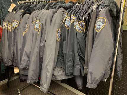 "Superheroes Show" - Rack full of Police Department Liberty Justice uniform jackets & shirts (approx | Direct Liquidation