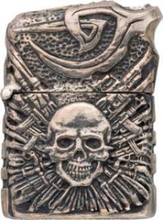 An Ornate Zippo Cigarette Lighter from "The Expendables 2" and "The Expendables 3." ...