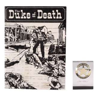UNFORGIVEN (1992) - Lot #1866 : W.W. Beauchamp‘s (Saul Rubinek) "The Duke of Death" Novel Cover with Lucite-Encased Deputy Sheriff Badge Crew Gift