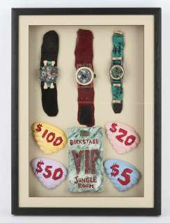 Lot 4666 - The Flintstones - Framed display of props from the movie including three watches (one dual signed),…