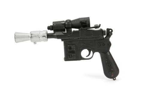 Lot 932 - RETURN OF THE JEDI HAN SOLO MOVIE PROP DL-44 BLASTER AND DVD