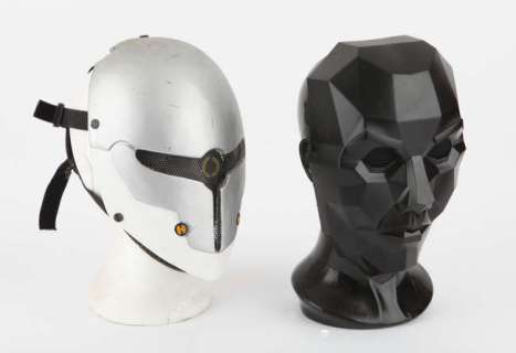 Lot 4614 - Squid Game - a Replica mask on black gloss display head accompanied by a SF themed mask - grey…