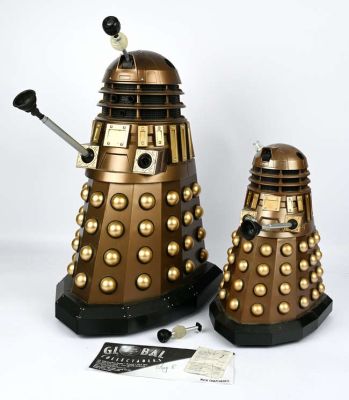 Lot 98 - BBC/ Terry Nation, two models of Daleks, in gold colourway, 48 and 31cm high (2) | Ewbank’s