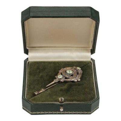 James Bond: the World Is Not Enough (1999) | Lot  293. Sir Robert King’s (David Calder) Lapel Badge | Propstore