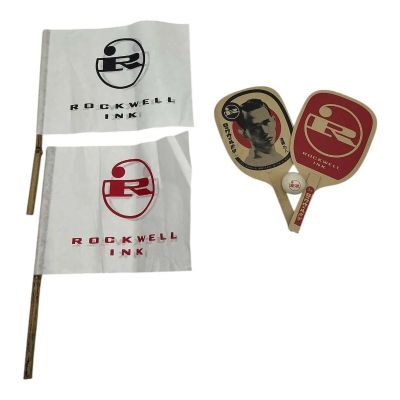 Lot 49: Marty Supreme Rockwell Event Attendees Screen Used (2) Rockwell Ink Ping Pong Paddle Set, Rockwell Ink Ping Pong Ball & 2 Piece Rockwell Ink Flag Set | VIP Fan Auctions