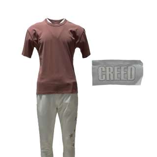 Creed III Adonis Creed Michael B Jordan Production Worn Short Sleeve Shirt, Elastic Waist Pants & Creed Stitch - Lot #309 - Creed III Adonis Creed Michael B Jordan Production Worn Short Sleeve Shirt, Elastic Waist Pants & Creed Stitch:… | VIP Fan Auctions