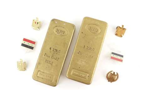 House of Saddam - Two replica gold bars, collection of six badges and two photos from the set of… | Ewbank’s