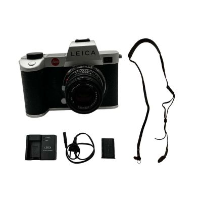 Lot 24: The Sheep Detectives Elliot Mathews Screen Used Camera W/ Strap, Adapter W/ Lens & Battery & Charger | VIP Fan Auctions
