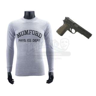 BEVERLY HILLS COP (1984)/BEVERLY HILLS COP II (1987) - Lot 528 - Axel Foley‘s (Eddie Murphy) Gun and "Mumford" T-Shirt