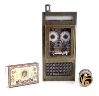 Netflix‘s A Series of Unfortunate Events (TV Series) - Lot 188 - V.F.D. Half Spyglass, Lock, and Matchbook