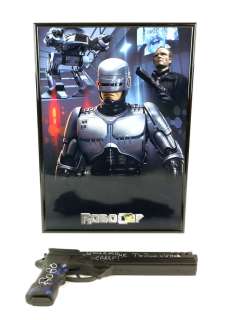 Robocop (1987) plastic gun in framed display, hand signed in silver by Peter Weller "ROBO Your… | Ewbank’s