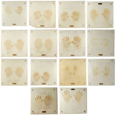 Planet Hollywood Memorabilia | Lot 467 : Collection of 14 Celebrity Handprint Impression Displays | Propstore