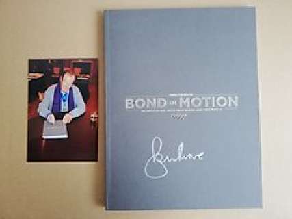 James Bond | James Bond - ’Bond in Motion’ Book - signed in person by Sir Roger Moore (10-10-2015) with photoproof | Catawiki