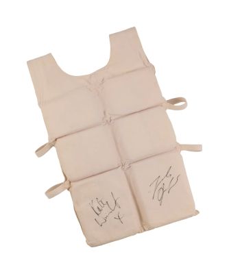 Titanic | Lot #343 - Production-Made Life Vest Prop Signed by Leonardo DiCaprio and Kate Winslet | Julien’s