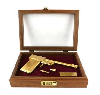Lot 7147 - James Bond The Man With The Golden Gun - A replica golden gun, 24 karat gold-plated replica…