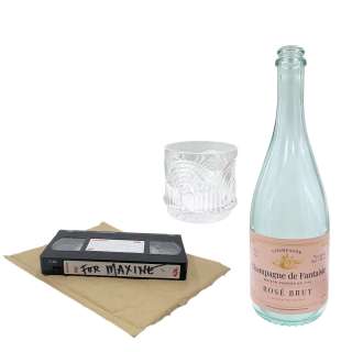 Maxxxine Maxine (Mia Goth) Production Used Glass Cup, Wine Bottle, & VHS Tape W/ Mailer Pouch | VIP Fan Auctions