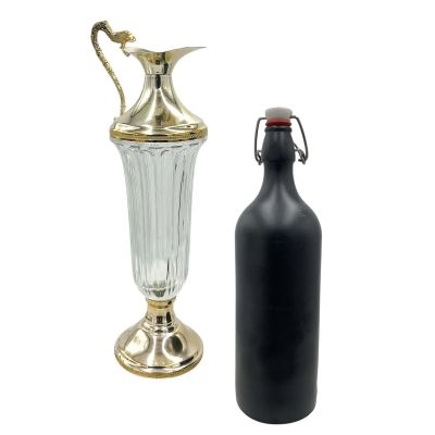 Lot 99: The Handmaid’s Tale Joseph Lawrence Production Used Bottle & Carafes | VIP Fan Auctions